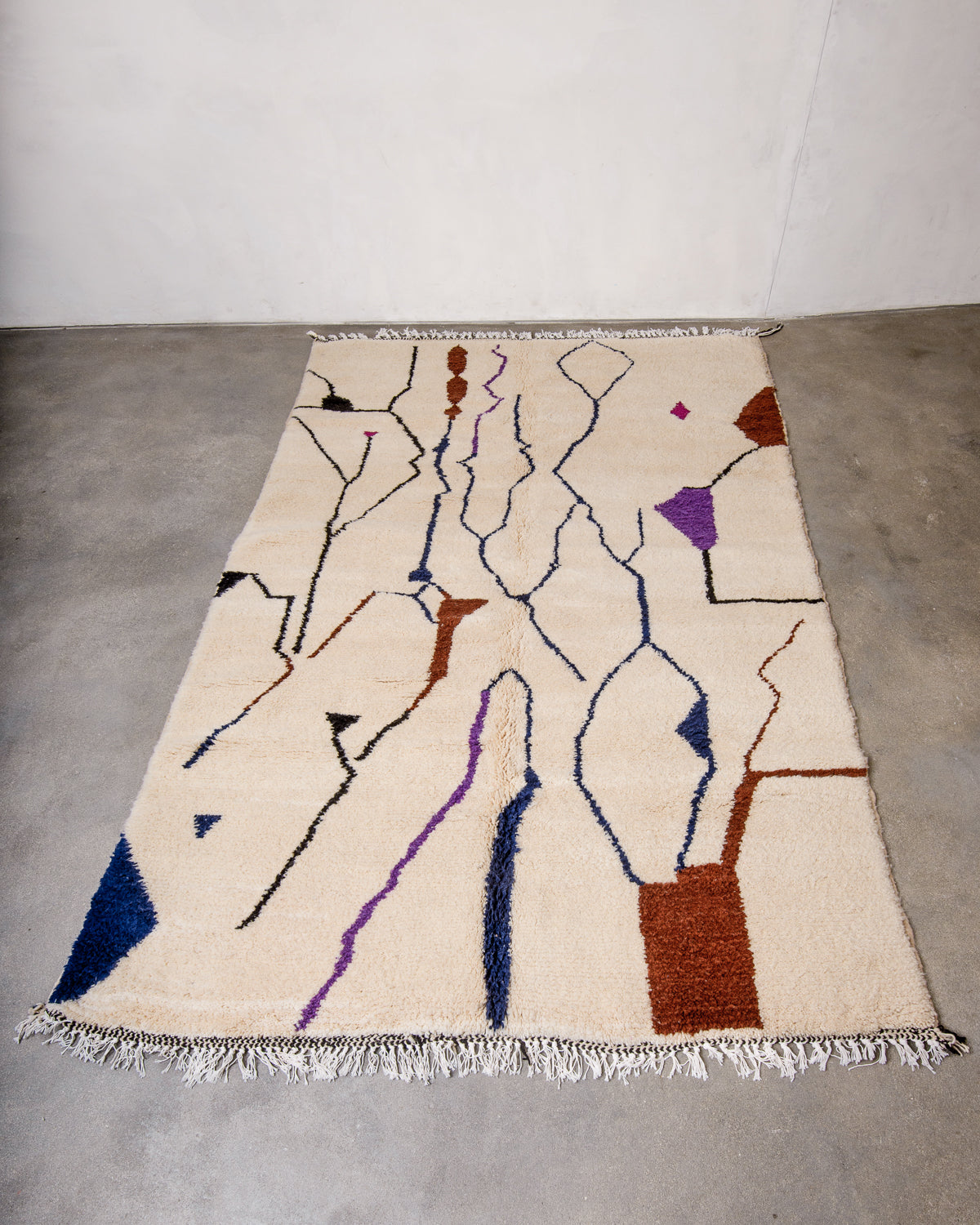 Modern, designer, handcrafted Berber rug from Morocco. Beniourain carpet with beautiful colours and patterns and fluffy wool texture.